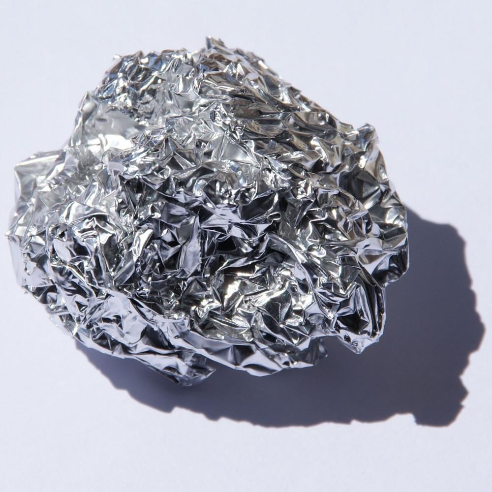 Crumpled aluminum foil illustrating the dangers of heavy metals.